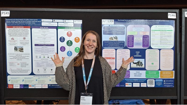 A person standing in front of a board
Description automatically generated